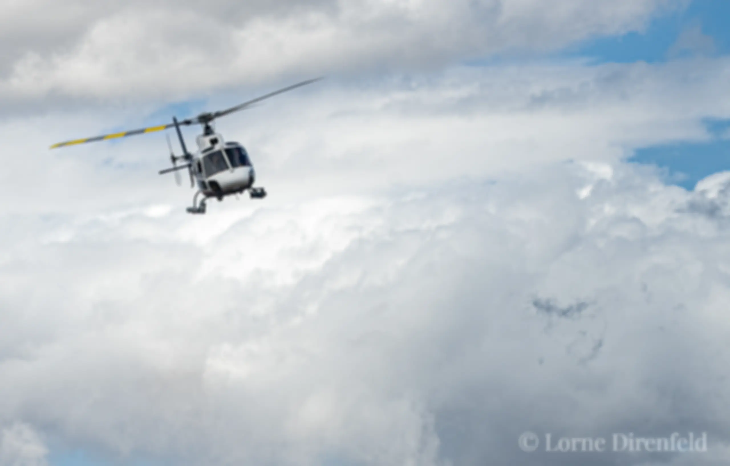 An Aérospatiale tour helicopter departs Kahului, Maui