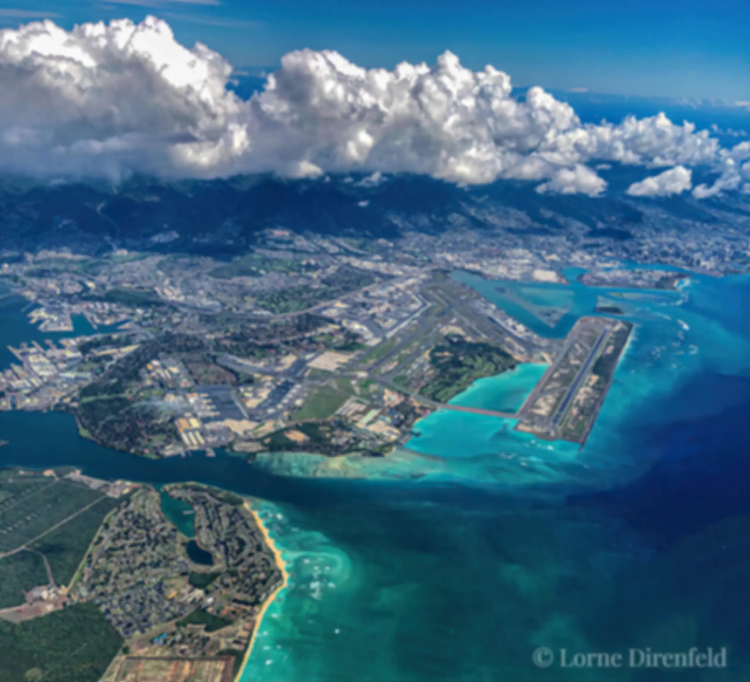 Looking down from 9000 feet, in the late morning at the Honolulu airport and the beautiful blue ocean . . .