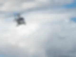 An Aérospatiale tour helicopter departs Kahului, Maui