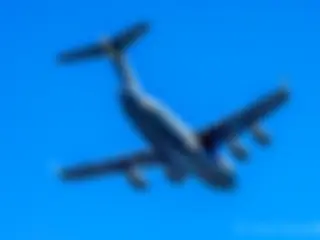 A C-17 Globemaster III with the Hawaii Air National Guard departs Kona airport . . .