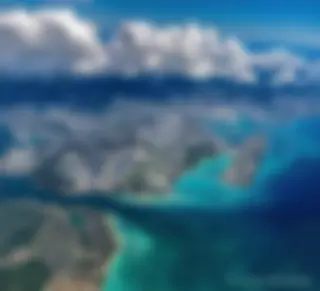 Looking down from 9000 feet, in the late morning at the Honolulu airport and the beautiful blue ocean . . .