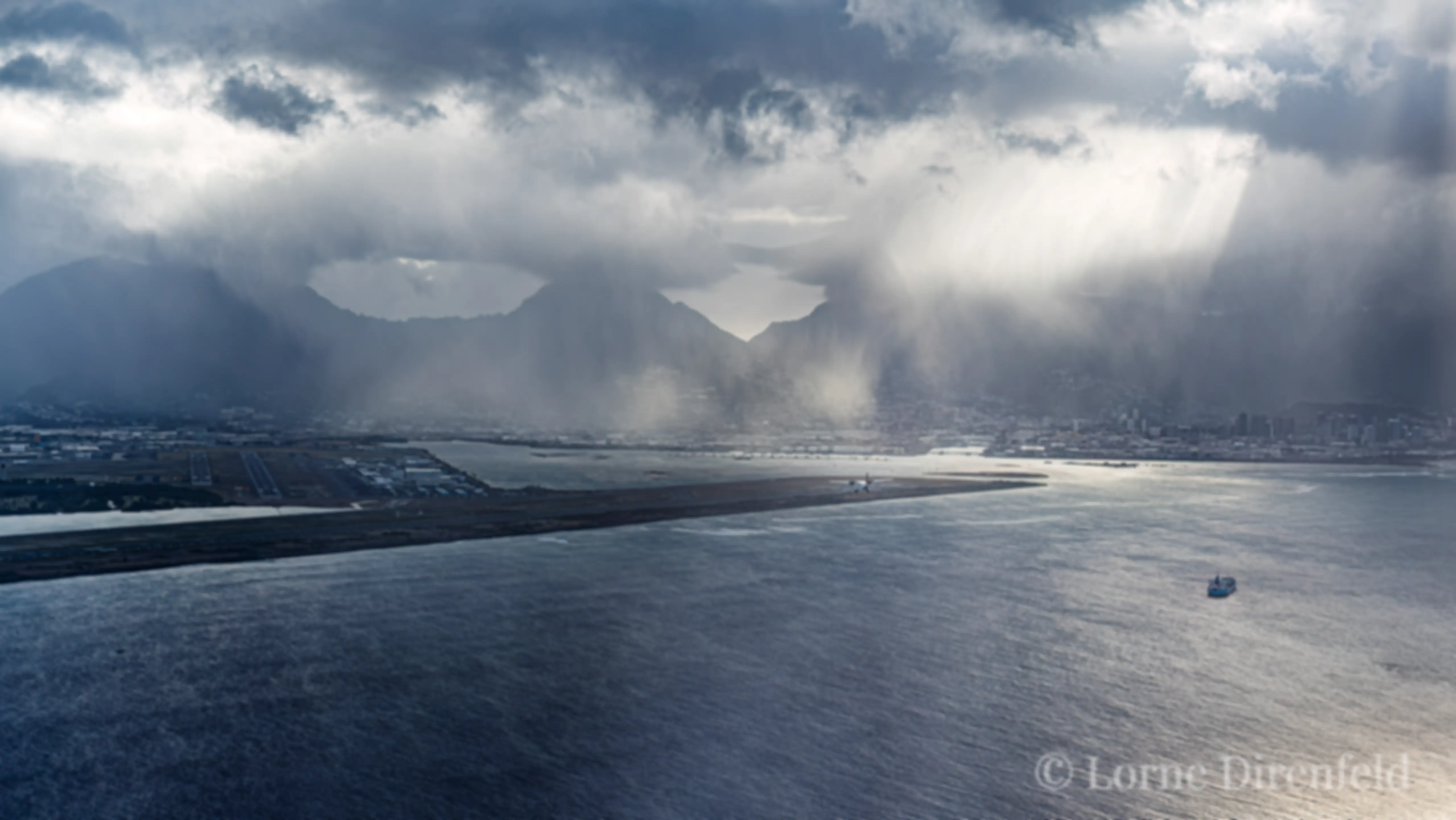 Can you see that guy? We're following a Shorts 360 on approach to Runway 4R in Honolulu on a misty morning . . .