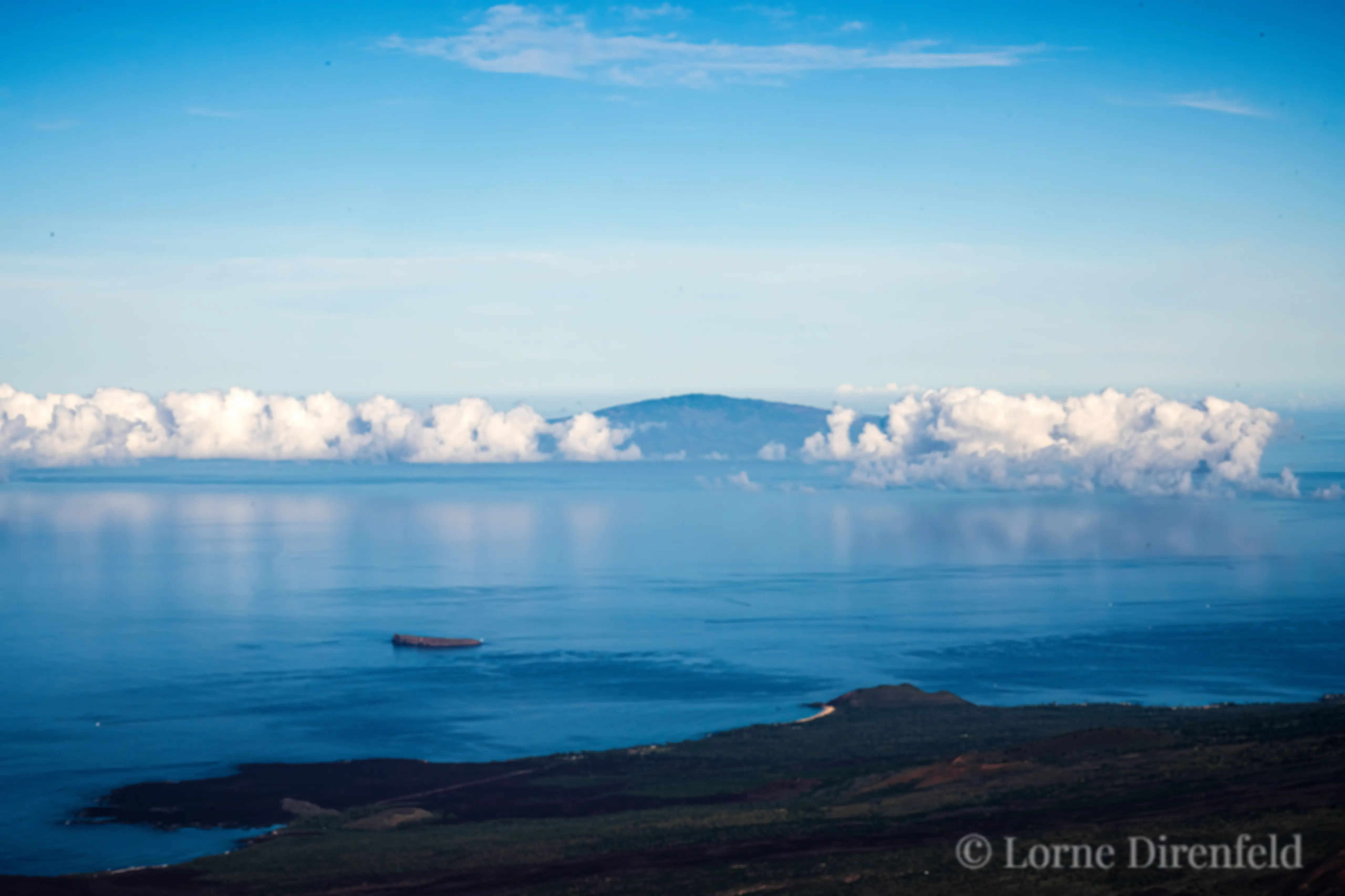 Lanai is in the distance, with Molokini and Makena Big Beach Maui in the foreground . . .