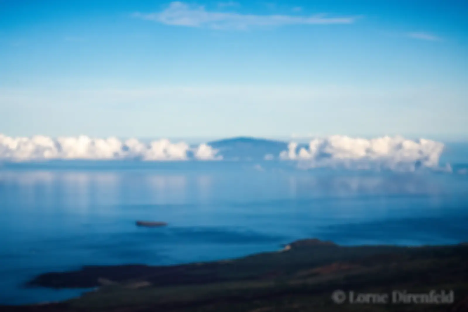Lanai is in the distance, with Molokini and Makena Big Beach Maui in the foreground . . .