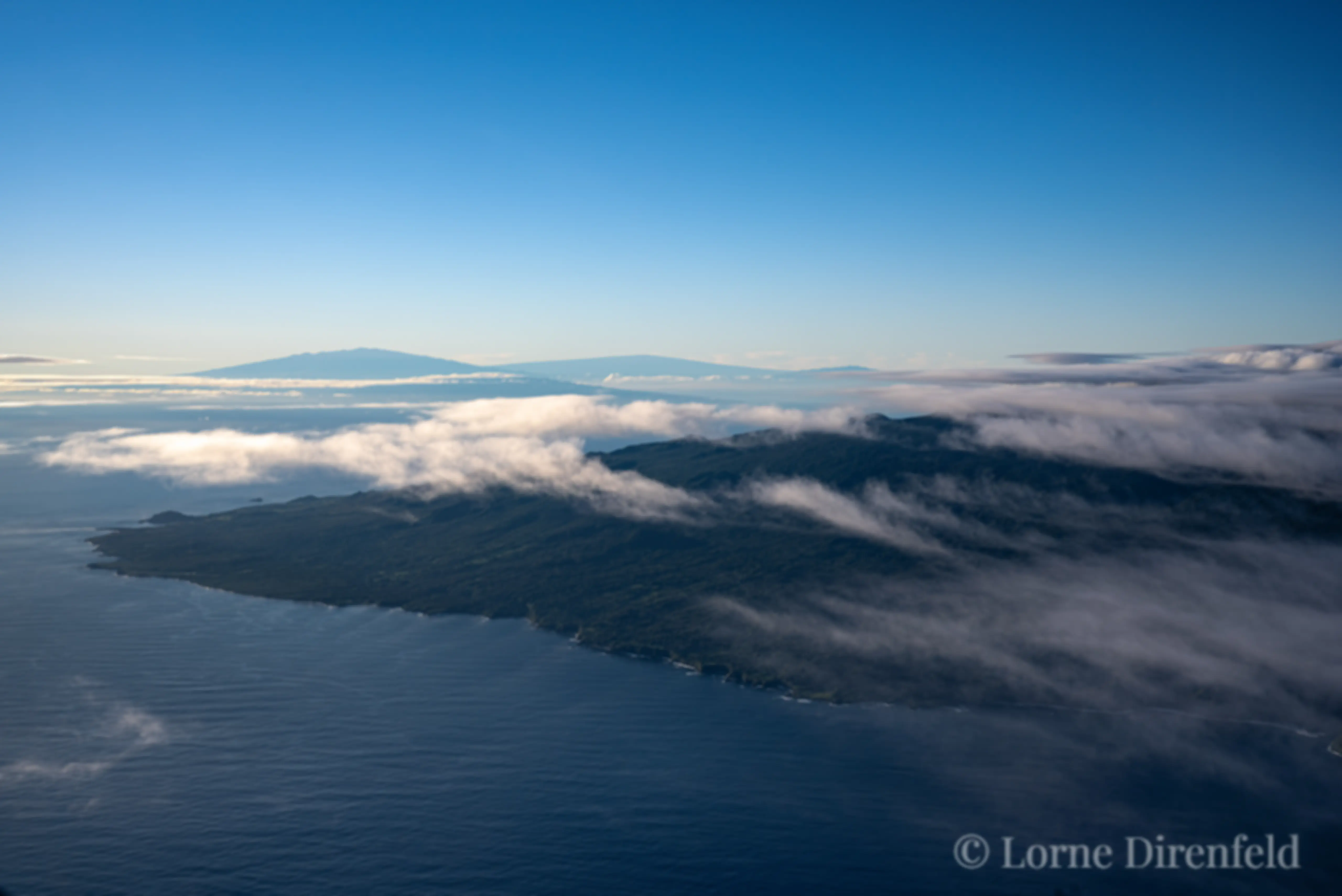 East Maui is in the foreground and the north end of the Big Island is in the distance as seen from 9,000 feet in the early morning . . .