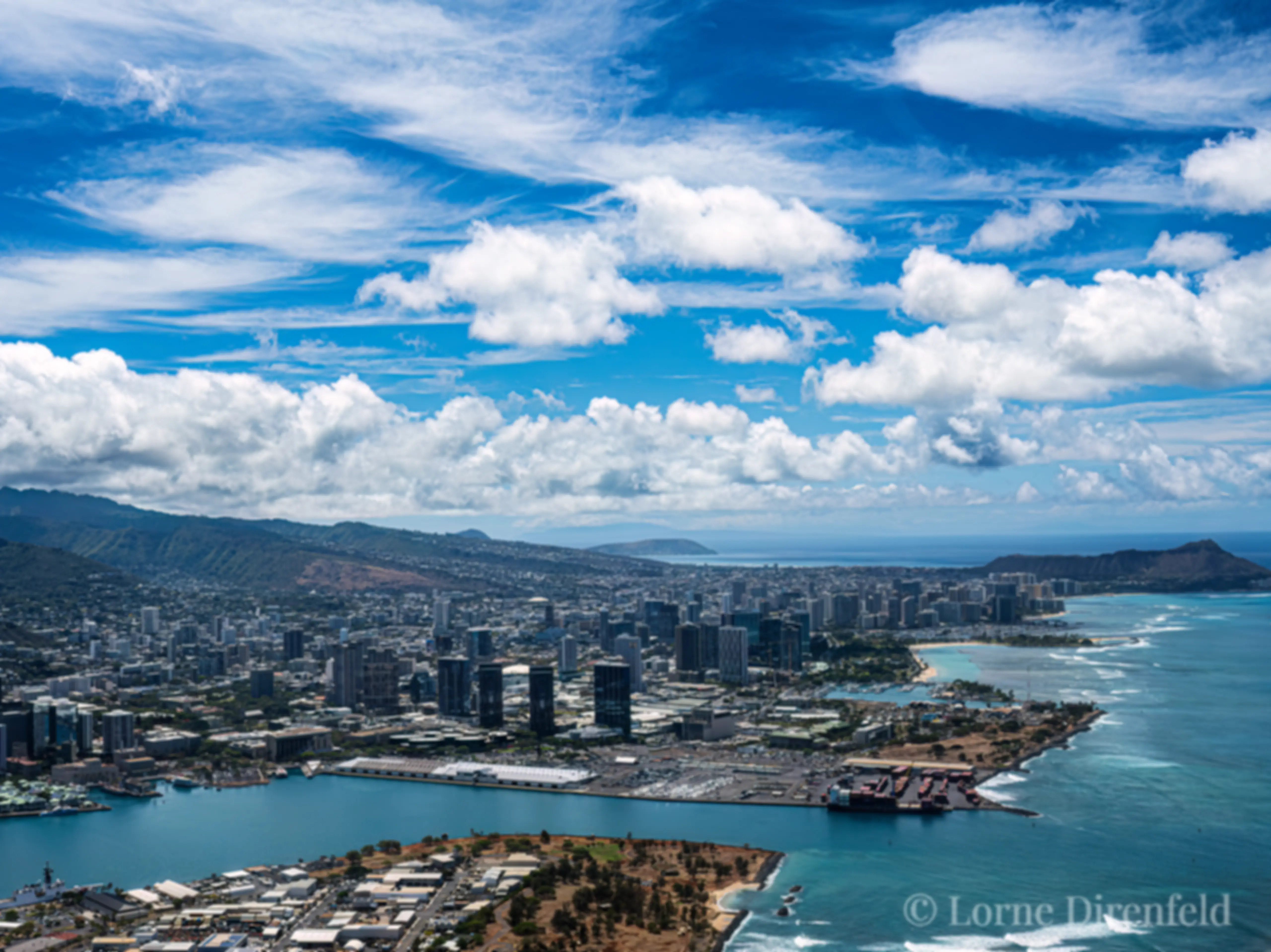 Departing Honolulu airport and looking to the east, beyond the harbor, downtown and Waikiki to Diamond Head . . .
