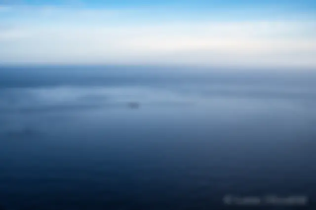 Tug and barge lifeline in Hawaii, on a calm ocean day . . .