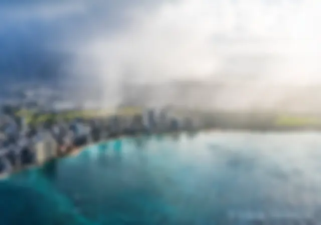A morning shower on land, with clear skies and blue water off shore . . .